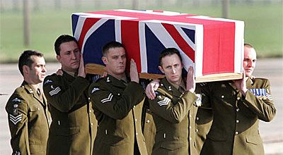 British military personnel carry the coffin of one of 10 Royal Air Force servicemen repatriated in Wiltshire, south-western England.  The 10 were killed while serving in Iraq.